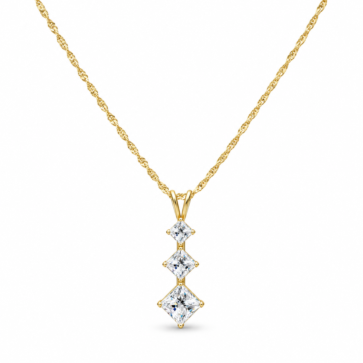 14K yellow gold three-stone pendant necklace with a delicate twisted chain on white background
